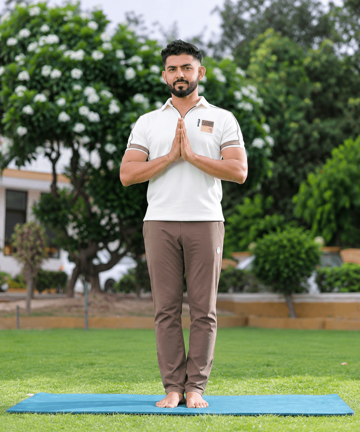 NITYOG yoga instructor sitting calmly, looking toward the horizon