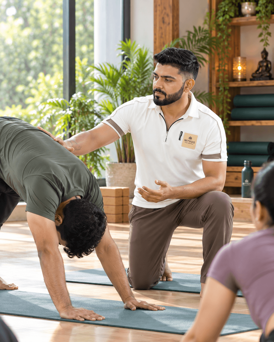 NITYOG member practicing yoga calmly at home